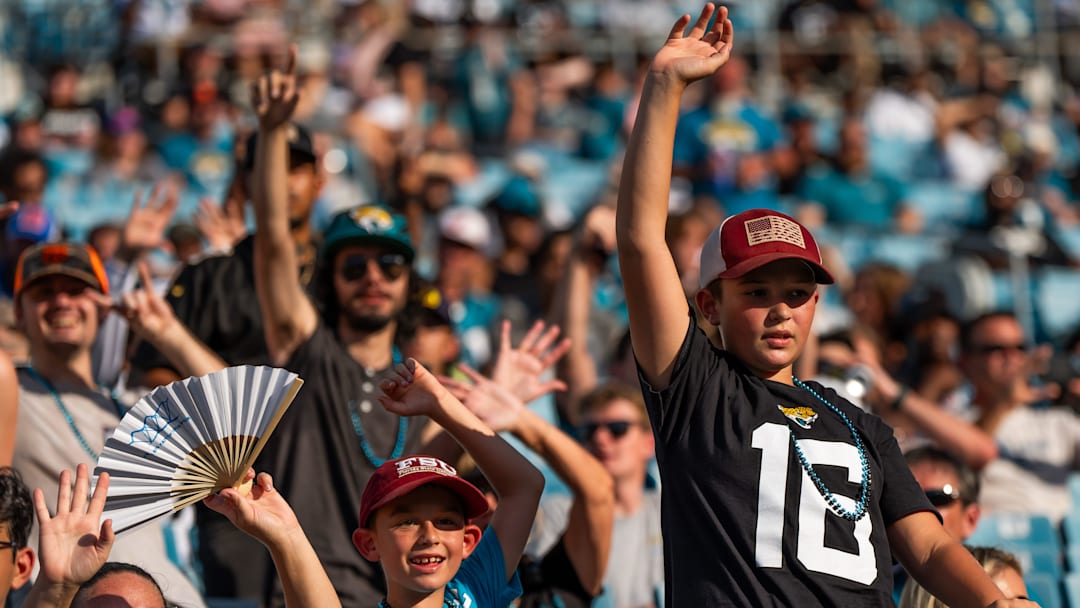 Jaguar fans wave to their favorite player before an NFL scrimmage at EverBank Stadium Friday August 1, 2025, in Jacksonville, Fla. [Doug Engle/Florida Times-Union]