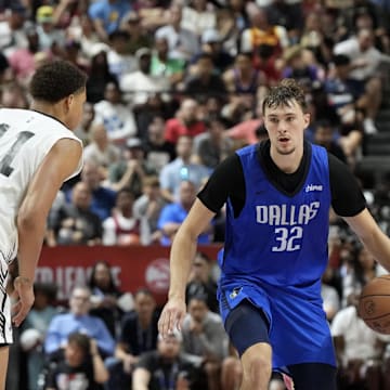 Dallas Mavericks forward Cooper Flagg dribbles against San Antonio Spurs forward Carter Bryant.