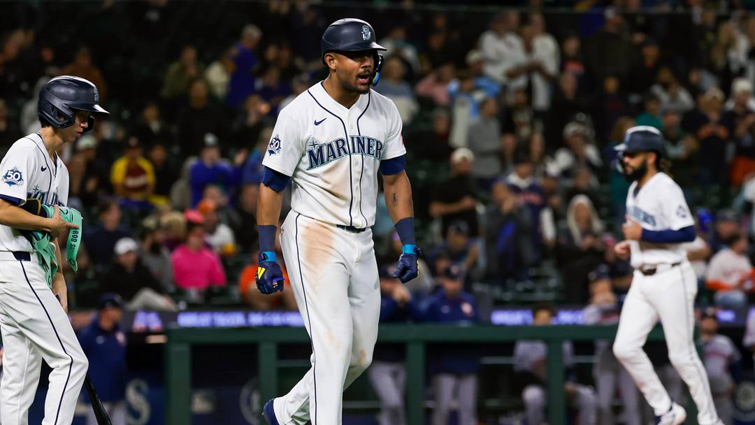 Sep 23, 2026; Seattle, Washington, USA; Seattle Mariners center fielder Julio Rodríguez (44) reacts after drawing an RBI-walk against the Houston Astros during the tenth inning at T-Mobile Park. Mandatory Credit: Joe Nicholson-Imagn Images