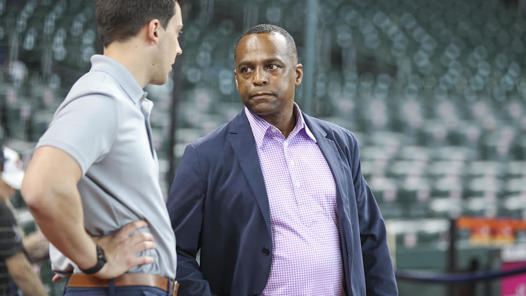 Aug 31, 2024; Houston, Texas, USA; Houston Astros general manager Dana Brown (right) talks before the game against the Kansas City Royals at Minute Maid Park. Mandatory Credit: Troy Taormina-Imagn Images