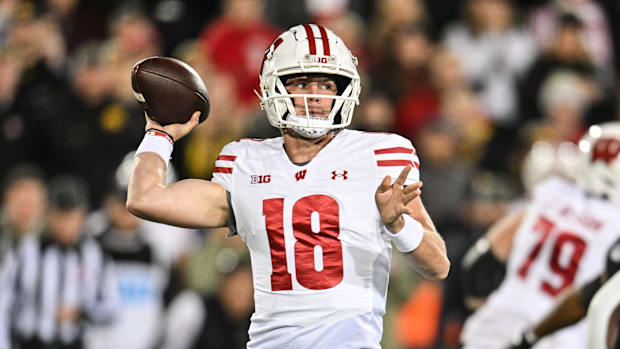 November 2, 2024; Iowa City, Iowa, USA; Wisconsin Badgers quarterback Braedyn Locke (18) throws a pass against the Iowa Hawkeyes d