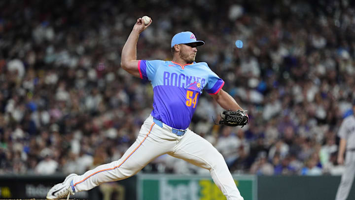 May 23, 2025; Denver, Colorado, USA; Colorado Rockies relief pitcher Zach Agnos (36) delivers a pitch in the ninth inning against the New York Yankees at Coors Field. Mandatory Credit: Ron Chenoy-Imagn Images