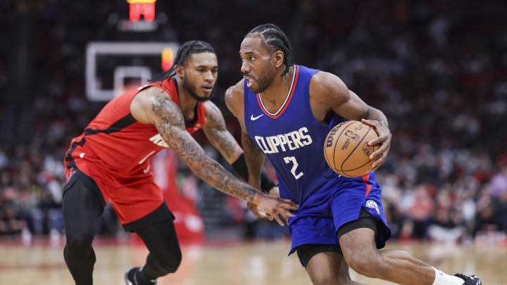 Mar 6, 2024; Houston, Texas, USA; Los Angeles Clippers forward Kawhi Leonard (2) drives with the ball around Houston Rockets forward Cam Whitmore (7) during the fourth quarter at Toyota Center. Mandatory Credit: Troy Taormina-USA TODAY Sports