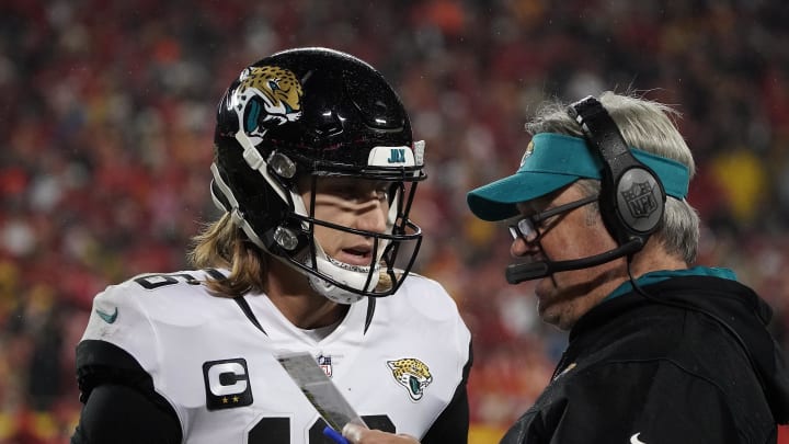 Jan 21, 2023; Kansas City, Missouri, USA; Jacksonville Jaguars head coach Doug Pederson gives the play to quarterback Trevor Lawrence (16) against the Kansas City Chiefs during the second half in the AFC divisional round game at GEHA Field at Arrowhead Stadium. Mandatory Credit: Denny Medley-USA TODAY Sports