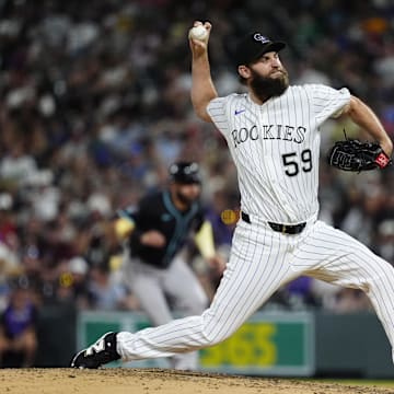 Jun 21, 2025; Denver, Colorado, USA; Colorado Rockies relief pitcher Jake Bird (59) delivers a pitch in the eighth inning against the Colorado Rockies at Coors Field. Mandatory Credit: Ron Chenoy-Imagn Images