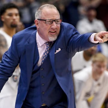 Mar 13, 2025; Nashville, TN, USA;  Texas A&M Aggies head coach Buzz Williams yells instructions to his team against the Texas Longhorns during the second half at Bridgestone Arena. Mandatory Credit: Steve Roberts-Imagn Images
