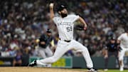 Jun 21, 2025; Denver, Colorado, USA; Colorado Rockies relief pitcher Jake Bird (59) delivers a pitch in the eighth inning against the Colorado Rockies at Coors Field. Mandatory Credit: Ron Chenoy-Imagn Images