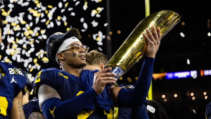 Jan 8, 2024; Houston, TX, USA; Michigan Wolverines defensive back Will Johnson (2) celebrates with the championship trophy after defeating the Washington Huskies during the 2024 College Football Playoff national championship game at NRG Stadium. Mandatory Credit: Mark J. Rebilas-USA TODAY Sports