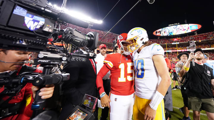 Sep 15, 2022; Kansas City, Missouri, USA; Los Angeles Chargers quarterback Justin Herbert (10) meets with Kansas City Chiefs quarterback Patrick Mahomes (15) following the game at GEHA Field at Arrowhead Stadium. Mandatory Credit: Jay Biggerstaff-USA TODAY Sports