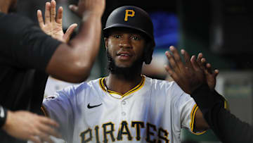 Sep 24, 2024; Pittsburgh, Pennsylvania, USA; Pittsburgh Pirates right fielder Bryan De La Cruz (41) celebrates with teammates in the dugout after scoring a run against the Milwaukee Brewers  during the second inning at PNC Park. Mandatory Credit: Charles LeClaire-Imagn Images