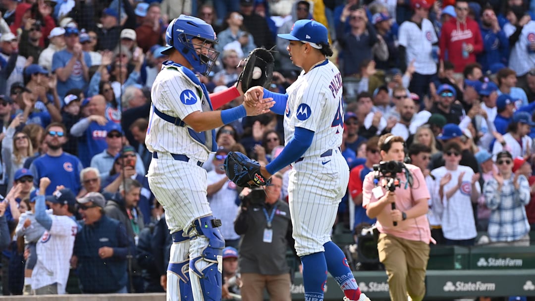 May 26, 2025; Chicago, Illinois, USA; Chicago Cubs catcher Reese McGuire (left) and relief pitcher Daniel Palencia (right) celebrate after defeating the Colorado Rockies at Wrigley Field. Mandatory Credit: Patrick Gorski-Imagn Images