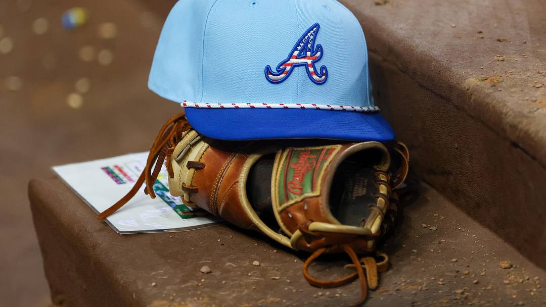 Jul 4, 2025; Atlanta, Georgia, USA; A detailed view of the Atlanta Braves 4th of July hat in the dugout against the Baltimore Orioles in the seventh inning at Truist Park. Mandatory Credit: Brett Davis-Imagn Images
