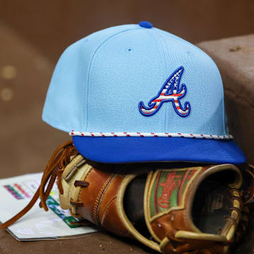 Jul 4, 2025; Atlanta, Georgia, USA; A detailed view of the Atlanta Braves 4th of July hat in the dugout against the Baltimore Orioles in the seventh inning at Truist Park. Mandatory Credit: Brett Davis-Imagn Images

