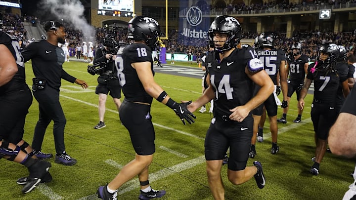 Oct 4, 2025; Fort Worth, Texas, USA; TCU Horned Frogs wide receiver Ed Small (18) and wide receiver Joseph Manjack IV (14) react after a touchdown during the second half at Amon G. Carter Stadium. Mandatory Credit: Raymond Carlin III-Imagn Images