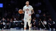 Nov 12, 2025; Miami, Florida, USA; Cleveland Cavaliers guard Lonzo Ball (2) dribbles the basketball against the Miami Heat during the first quarter at Kaseya Center. Mandatory Credit: Sam Navarro-Imagn Images