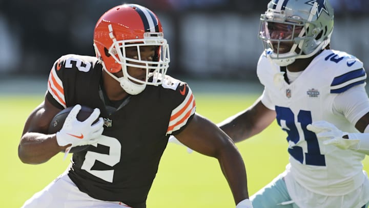 Sep 8, 2024; Cleveland, Ohio, USA; Cleveland Browns wide receiver Amari Cooper (2) runs with the ball after a catch as Dallas Cowboys cornerback Caelen Carson (21) defends during the first quarter at Huntington Bank Field. Mandatory Credit: Ken Blaze-Imagn Images