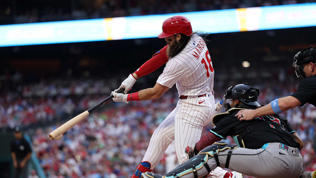 May 3, 2025; Philadelphia, Pennsylvania, USA; Philadelphia Phillies outfielder Brandon Marsh (8) hits an RBI double against the Arizona Diamondbacks during the second inning at Citizens Bank Park. 