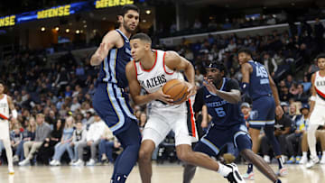 Mar 1, 2024; Memphis, Tennessee, USA; Portland Trail Blazers forward Kris Murray (8) drives to the basket as Memphis Grizzlies forward-center Santi Aldama (7) and Memphis Grizzlies guard Vince Williams Jr. (5) defend during the first half at FedExForum. Mandatory Credit: Petre Thomas-Imagn Images