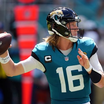 Sep 8, 2024; Miami Gardens, Florida, USA;  Jacksonville Jaguars quarterback Trevor Lawrence (16) drops back to pass against the Miami Dolphins during the third quarter at Hard Rock Stadium. Mandatory Credit: Jim Rassol-Imagn Images