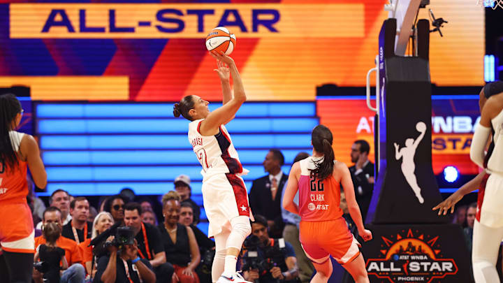 Jul 20, 2024; Phoenix, AZ, USA; USA Women's National Team guard Diana Taurasi (12) shoots for the basket during the first half against the Team WNBA at Footprint Center. Mandatory Credit: Mark J. Rebilas-Imagn Images