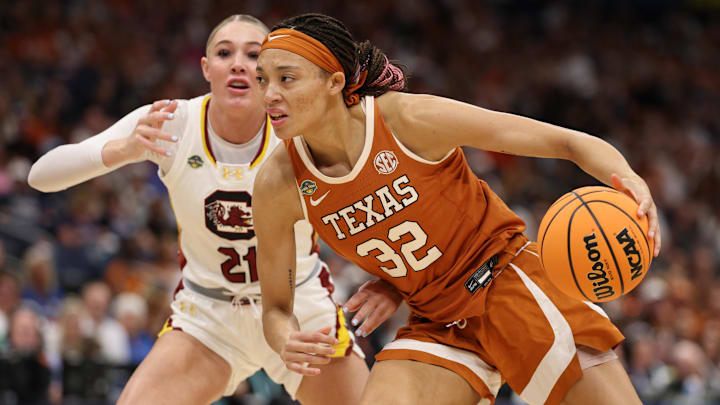 Texas Longhorns guard Ndjakalenga Mwenentanda (32) drives against South Carolina Gamecocks forward Chloe Kitts (21) during the first half in a semifinal of the women's 2025 NCAA tournament at Amalie Arena. Texas Longhorns guard Ndjakalenga Mwenentanda (32) drives against South Carolina Gamecocks forward Chloe Kitts (21) during the first half in a semifinal of the women's 2025 NCAA tournament at Amalie Arena.