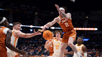 Texas guard Chendall Weaver (2) nearly grabs the rebound against Tennessee forward Igor Milicic Jr. (7) during the second half of their quarterfinal game of the SEC Men's Basketball Tournament at Bridgestone Arena in Nashville, Tenn., Friday, March 14, 2025.