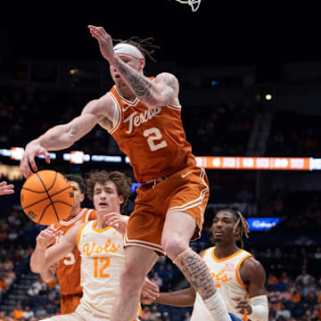 Texas guard Chendall Weaver (2) nearly grabs the rebound against Tennessee forward Igor Milicic Jr. (7) during the second half of their quarterfinal game of the SEC Men's Basketball Tournament at Bridgestone Arena in Nashville, Tenn., Friday, March 14, 2025.