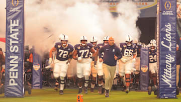 Penn State football head coach James Franklin leading the Nittany Lions out onto the field in the Orange Bowl