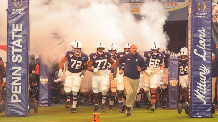 Penn State football head coach James Franklin leading the Nittany Lions out onto the field in the Orange Bowl