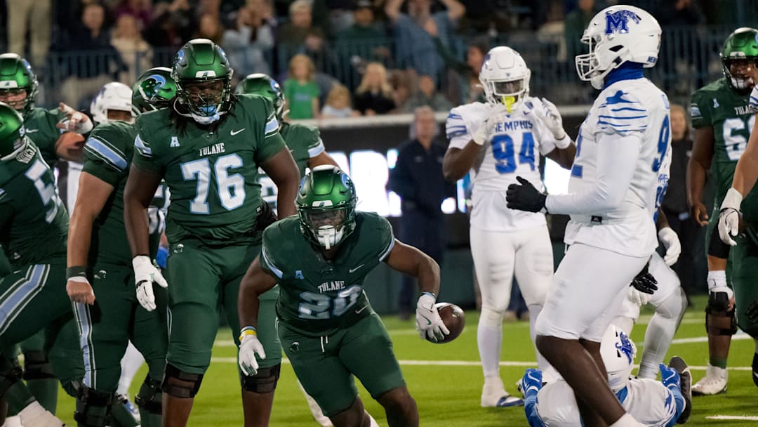 Nov 28, 2024; New Orleans, Louisiana, USA; Tulane Green Wave running back Arnold Barnes III (20) scores a touchdown against the Memphis Tigers during the fourth quarter at Yulman Stadium. Mandatory Credit: Matthew Hinton-Imagn Images