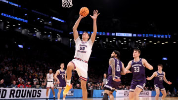 Mar 22, 2024; Brooklyn, NY, USA; Florida Atlantic Owls center Vladislav Goldin (50) drives to the basket against Northwestern Wildcats guards Ryan Langborg (5) and Boo Buie (0) and forward Luke Hunger (33) and guard Brooks Barnhizer (13) during the second half at Barclays Center. Mandatory Credit: Brad Penner-USA TODAY Sports