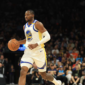 Apr 8, 2025; Phoenix, Arizona, USA; Golden State Warriors forward Jonathan Kuminga (00) against the Phoenix Suns at Footprint Center. Mandatory Credit: Mark J. Rebilas-Imagn Images
