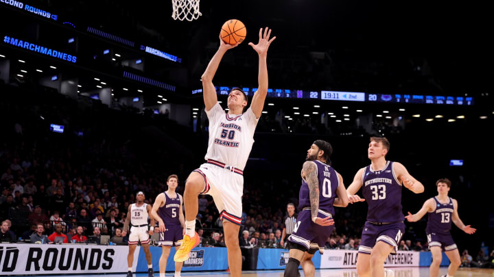 Mar 22, 2024; Brooklyn, NY, USA; Florida Atlantic Owls center Vladislav Goldin (50) drives to the basket against Northwestern Wildcats guards Ryan Langborg (5) and Boo Buie (0) and forward Luke Hunger (33) and guard Brooks Barnhizer (13) during the second half at Barclays Center. Mandatory Credit: Brad Penner-USA TODAY Sports