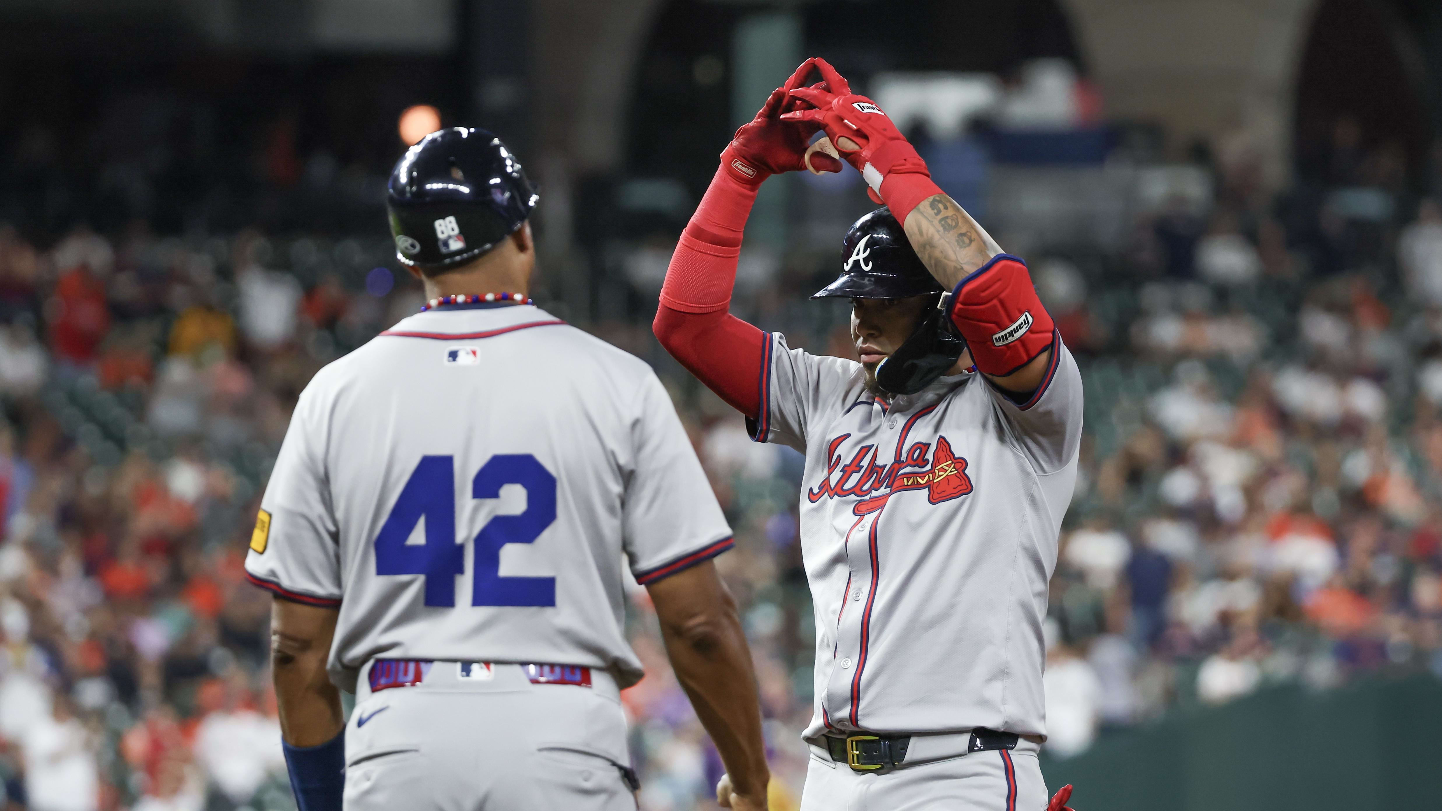 Atlanta Braves pitch hitter Orlando Arcia (11) hit a RBI single in the 9th inning, starting a late scoring surge that put this one away. 