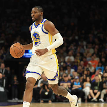 Apr 8, 2025; Phoenix, Arizona, USA; Golden State Warriors forward Jonathan Kuminga (00) against the Phoenix Suns at Footprint Center. Mandatory Credit: Mark J. Rebilas-Imagn Images