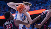 Nov 14, 2025; Chapel Hill, North Carolina, USA; North Carolina Tar Heels center Henri Veesaar (13) pulls in a rebound against North Carolina Central Eagles forward Ramondo Battle II (22) in the first half at Dean E. Smith Center. 