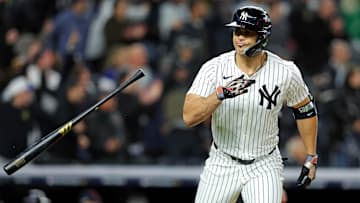 Oct 14, 2024; Bronx, New York, USA; New York Yankees designated hitter Giancarlo Stanton (27) hits a solo home run during the seventh inning against the Cleveland Guardians in game one of the ALCS for the 2024 MLB Playoffs at Yankee Stadium. Mandatory Credit: Brad Penner-Imagn Images