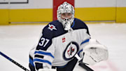 May 17, 2025; Dallas, Texas, USA; Winnipeg Jets goaltender Connor Hellebuyck (37) skates in warmups prior to the game against the Dallas Stars in game six of the second round of the 2025 Stanley Cup Playoffs at American Airlines Center. Mandatory Credit: Jerome Miron-Imagn Images