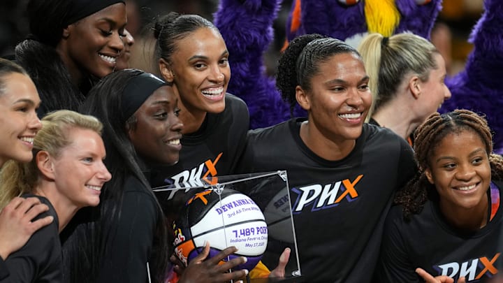 Phoenix Mercury players gather around teammate DeWanna Bonner as she is announced as the third all-time scorer in the WNBA before they play the Los Angeles Sparks at PHX Arena in Phoenix, on Sept. 9, 2025. Phoenix Mercury players gather around teammate DeWanna Bonner as she is announced as the third all-time scorer in the WNBA before they play the Los Angeles Sparks at PHX Arena in Phoenix, on Sept. 9, 2025.