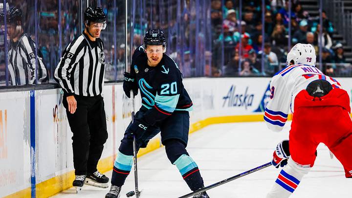 Nov 17, 2024; Seattle, Washington, USA; Seattle Kraken right wing Eeli Tolvanen (20) passes the puck against the New York Rangers during the first period at Climate Pledge Arena. Mandatory Credit: Joe Nicholson-Imagn Images Nov 17, 2024; Seattle, Washington, USA; Seattle Kraken right wing Eeli Tolvanen (20) passes the puck against the New York Rangers during the first period at Climate Pledge Arena. Mandatory Credit: Joe Nicholson-Imagn Images