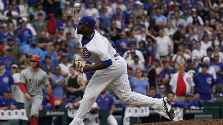 Jul 7, 2024; Chicago, Illinois, USA; Chicago Cubs pitcher Héctor Neris (51) throws the ball against the Los Angeles Angels during the ninth inning at Wrigley Field. Mandatory Credit: David Banks-USA TODAY Sports