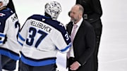 May 17, 2025; Dallas, Texas, USA; Winnipeg Jets goaltender Connor Hellebuyck (37) shakes hands with Dallas Stars head coach Pete DeBoer after the Stars defeat the Jets in the overtime period in game six of the second round of the 2025 Stanley Cup Playoffs at American Airlines Center. Mandatory Credit: Jerome Miron-Imagn Images