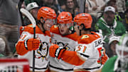Nov 6, 2025; Dallas, Texas, USA; Anaheim Ducks center Leo Carlsson (91) and defenseman Olen Zellweger (51) and right wing Troy Terry (19) celebrates a short handed goal scored by Carlsson against the Dallas Stars during the third period at the American Airlines Center. Mandatory Credit: Jerome Miron-Imagn Images