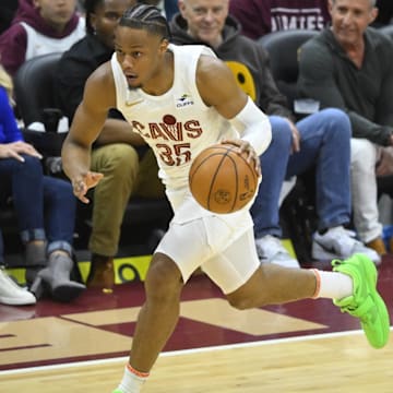 Apr 20, 2024; Cleveland, Ohio, USA; Cleveland Cavaliers forward Isaac Okoro (35) brings the ball up court in the fourth quarter against the Orlando Magic during game one of the first round for the 2024 NBA playoffs at Rocket Mortgage FieldHouse. Mandatory Credit: David Richard-Imagn Images