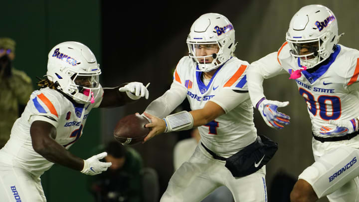 Oct 14, 2023; Fort Collins, Colorado, USA;  Boise State Broncos quarterback Maddux Madsen (4) hands off to Boise State Broncos running back Ashton Jeanty (2) in the first quarter against the Colorado State Rams at Sonny Lubick Field at Canvas Stadium. Mandatory Credit: Michael Madrid-USA TODAY Sports