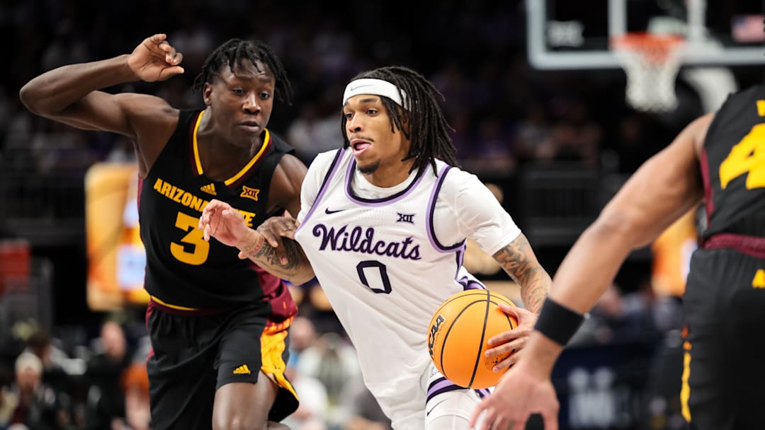 Mar 11, 2025; Kansas City, MO, USA; Kansas State Wildcats guard Dug McDaniel (0) drives to the basket around Arizona State Sun Devils guard Joson Sanon (3) during the first half at T-Mobile Center. Mandatory Credit: William Purnell-Imagn Images