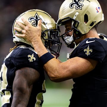 Sep 8, 2024; New Orleans, Louisiana, USA;  New Orleans Saints quarterback Derek Carr (4) celebrate a touchdown catch with wide receiver Rashid Shaheed (22) against the Carolina Panthers during the first half at Caesars Superdome. Mandatory Credit: Stephen Lew-Imagn Images