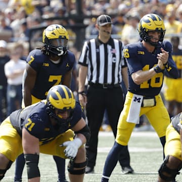 Sep 14, 2024; Ann Arbor, Michigan, USA;  Michigan Wolverines quarterback Davis Warren (16) prepares to run a play against the Arkansas State Red Wolves during the first half at Michigan Stadium. Mandatory Credit: Rick Osentoski-Imagn Images