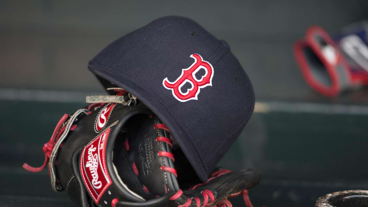 May 14, 2014; Minneapolis, MN, USA; A general view of a glove and Boston Red Sox hat in the dugout prior to a game between the Boston Red Sox and Minnesota Twins at Target Field. Mandatory Credit: Jesse Johnson-USA TODAY Sports