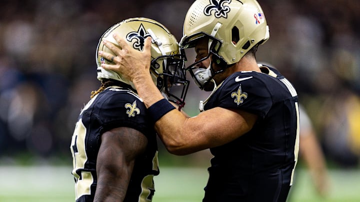 Sep 8, 2024; New Orleans, Louisiana, USA;  New Orleans Saints quarterback Derek Carr (4) celebrate a touchdown catch with wide receiver Rashid Shaheed (22) against the Carolina Panthers during the first half at Caesars Superdome. Mandatory Credit: Stephen Lew-Imagn Images